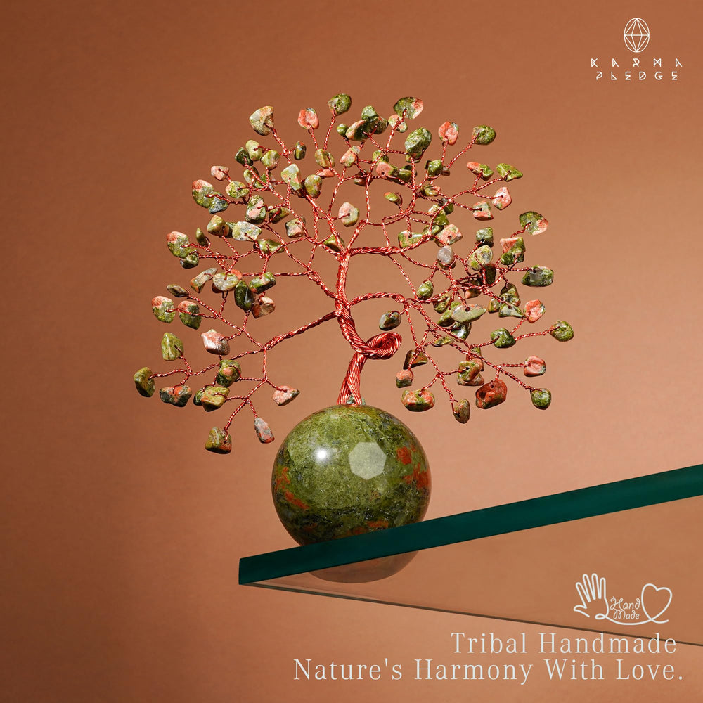 KARMAPLEDGE crystal ball base anchors the tree with a polished, elegant touch
