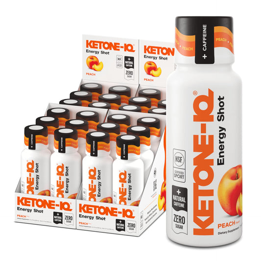 Ketone-IQ peach energy shot bottle closeup, features 5 g ketones and 100 mg caffeine for steady focus