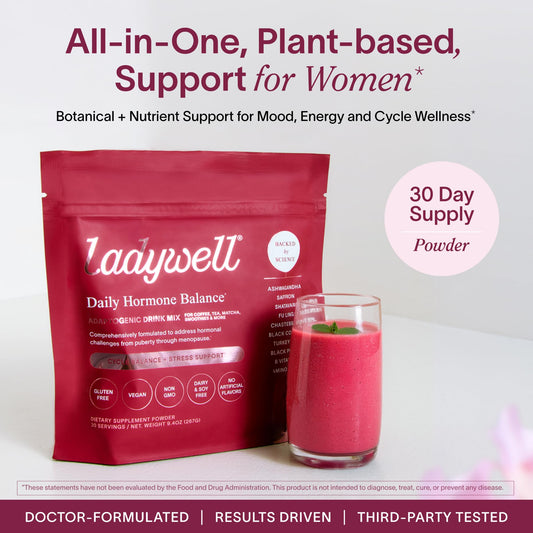 Scoop of Ladywell powder ready to blend into smoothies for energy and nutrients.