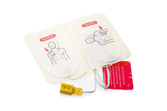 Laerdal AED Trainer Pads mounted on a CPR manikin for realistic practice.