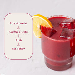 Close-up of strawberries, blueberries, and carrots in Daily Reds blend