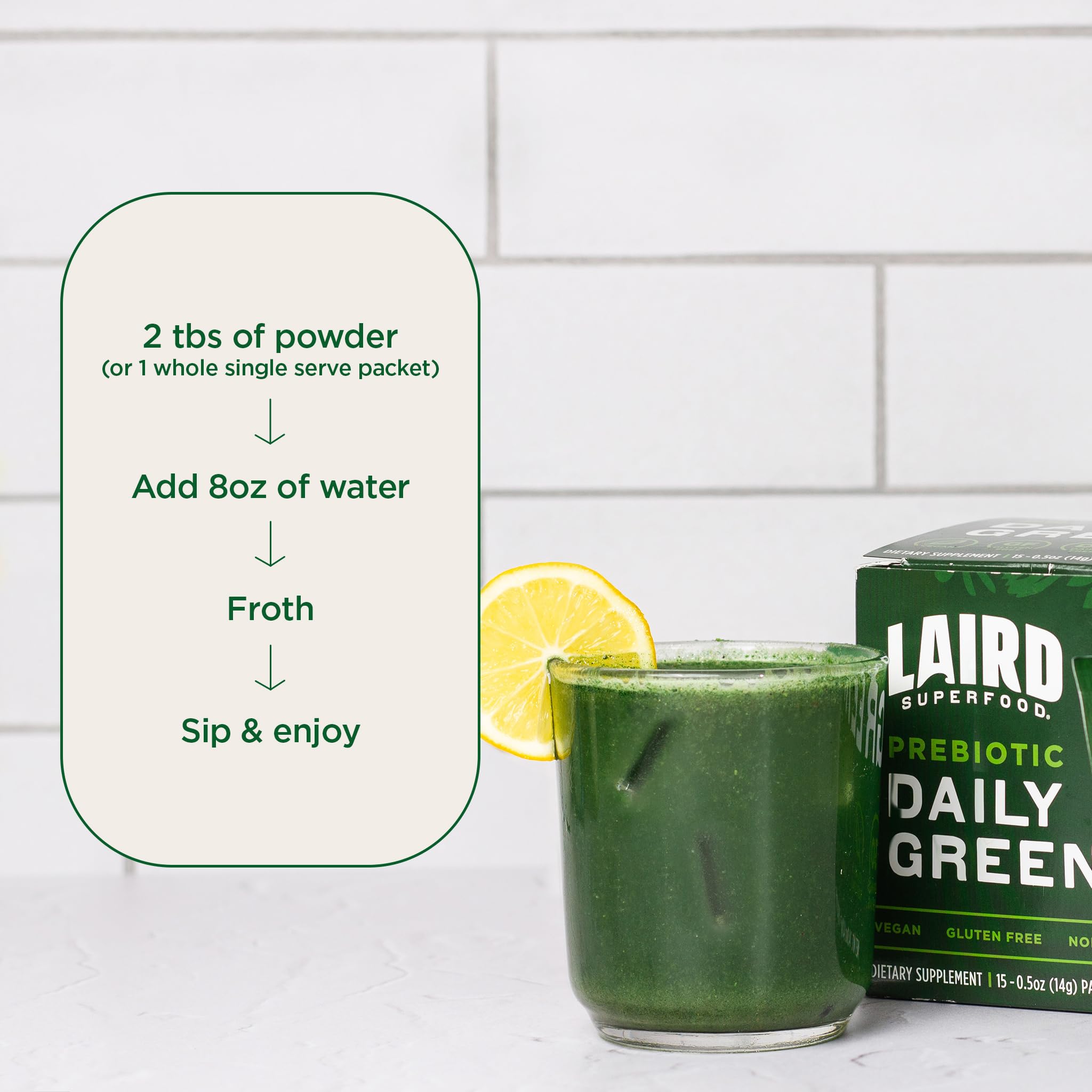 Laird Superfood Prebiotic Daily Greens glass with water shows versatile daily nutrition