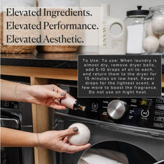 Wool dryer balls absorbing oil for softer, fragrant laundry.