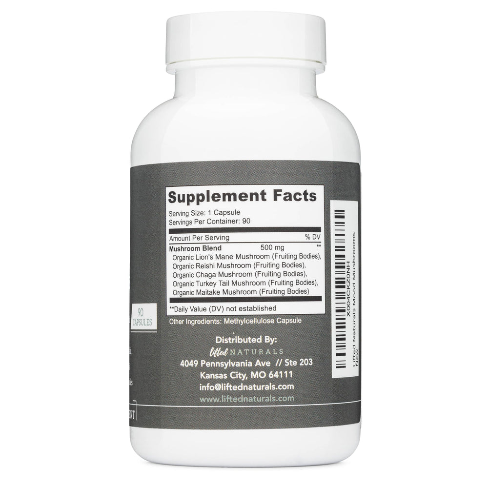 Lifted Naturals Mood Mushrooms capsules arranged beside a glass of water for easy daily routine.