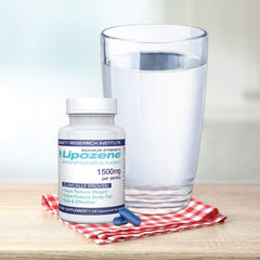 Lipozene measuring scoop beside bottle for simple daily use.