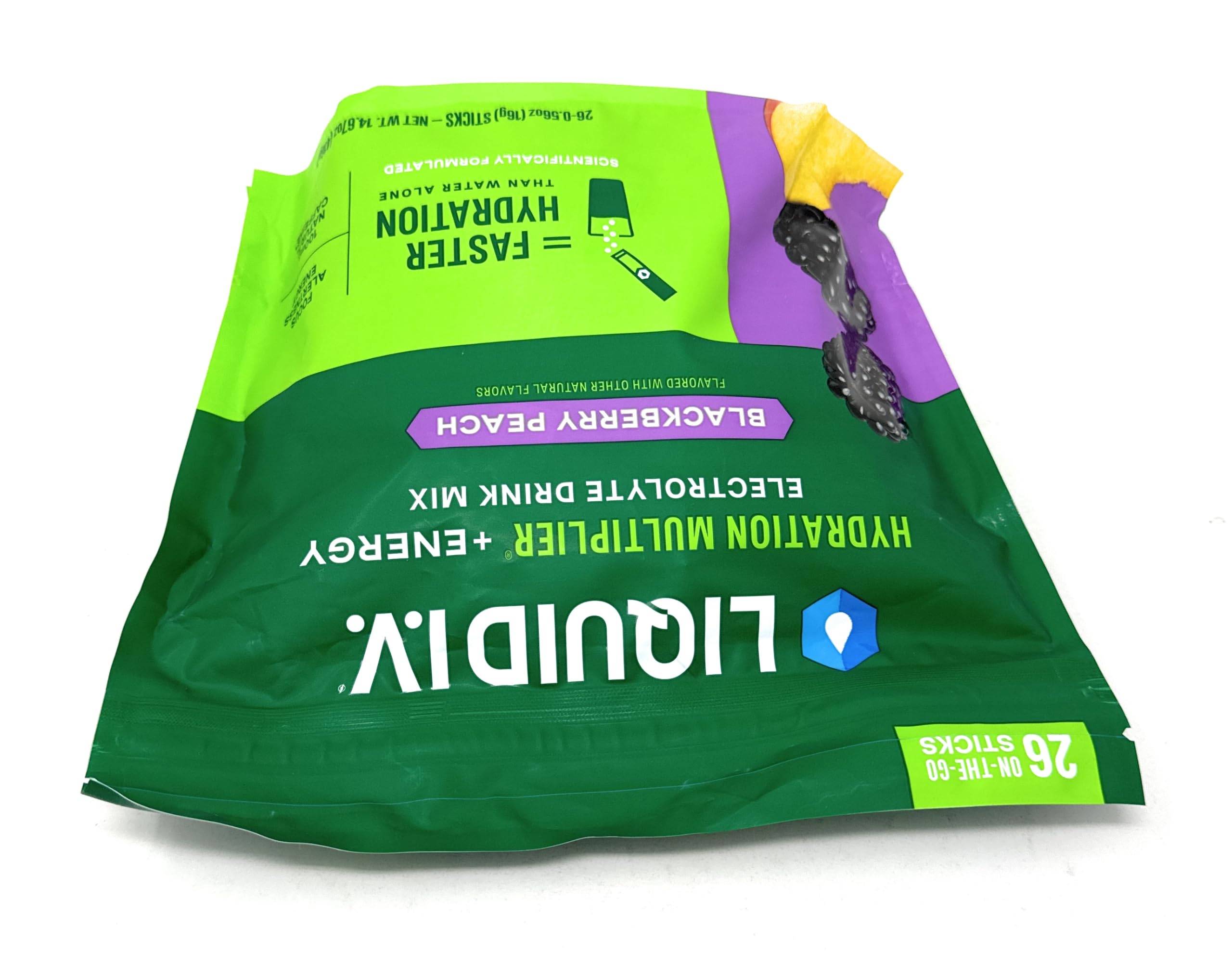 Liquid I.V. Hydration Multiplier energy at gym with bottle and towel.