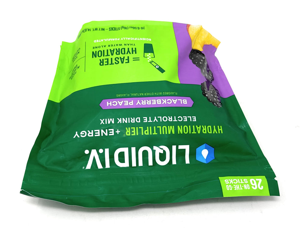 Liquid I.V. Hydration Multiplier energy at gym with bottle and towel.