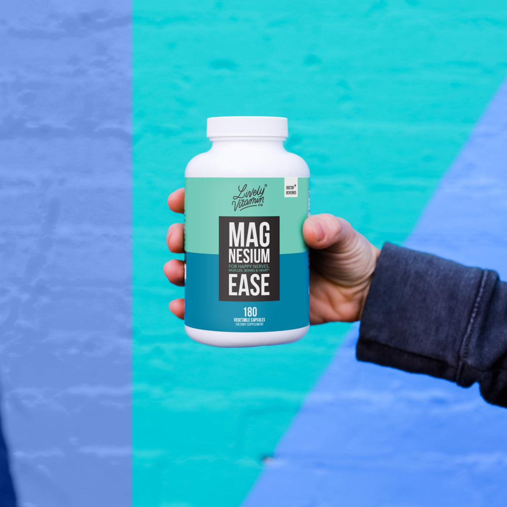Lively Vitamin Co Magnesium Ease vegan capsules on a spoon for serving