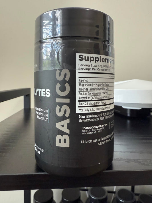 Livingood Daily Electrolytes Powder pour-glass demonstrates fast-dissolving hydration after workouts.
