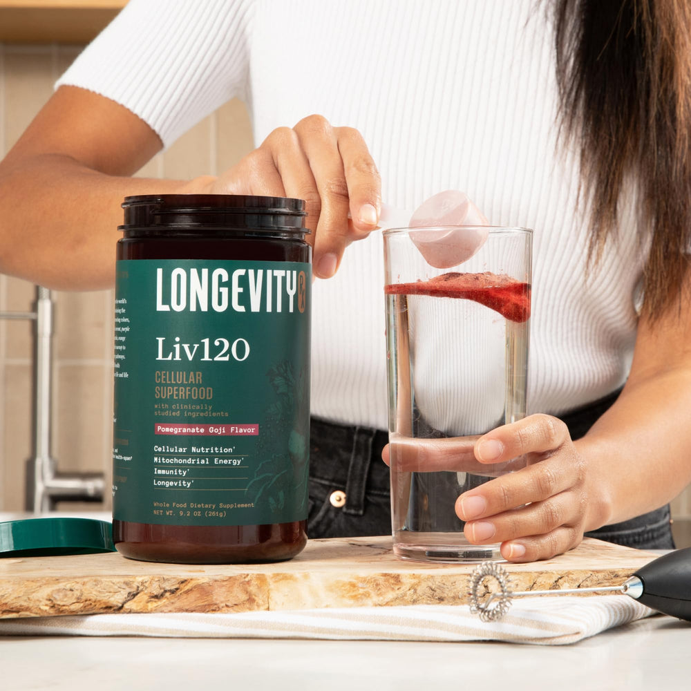 Longevity Rx Liv120 powder being poured into glass for energy and detox