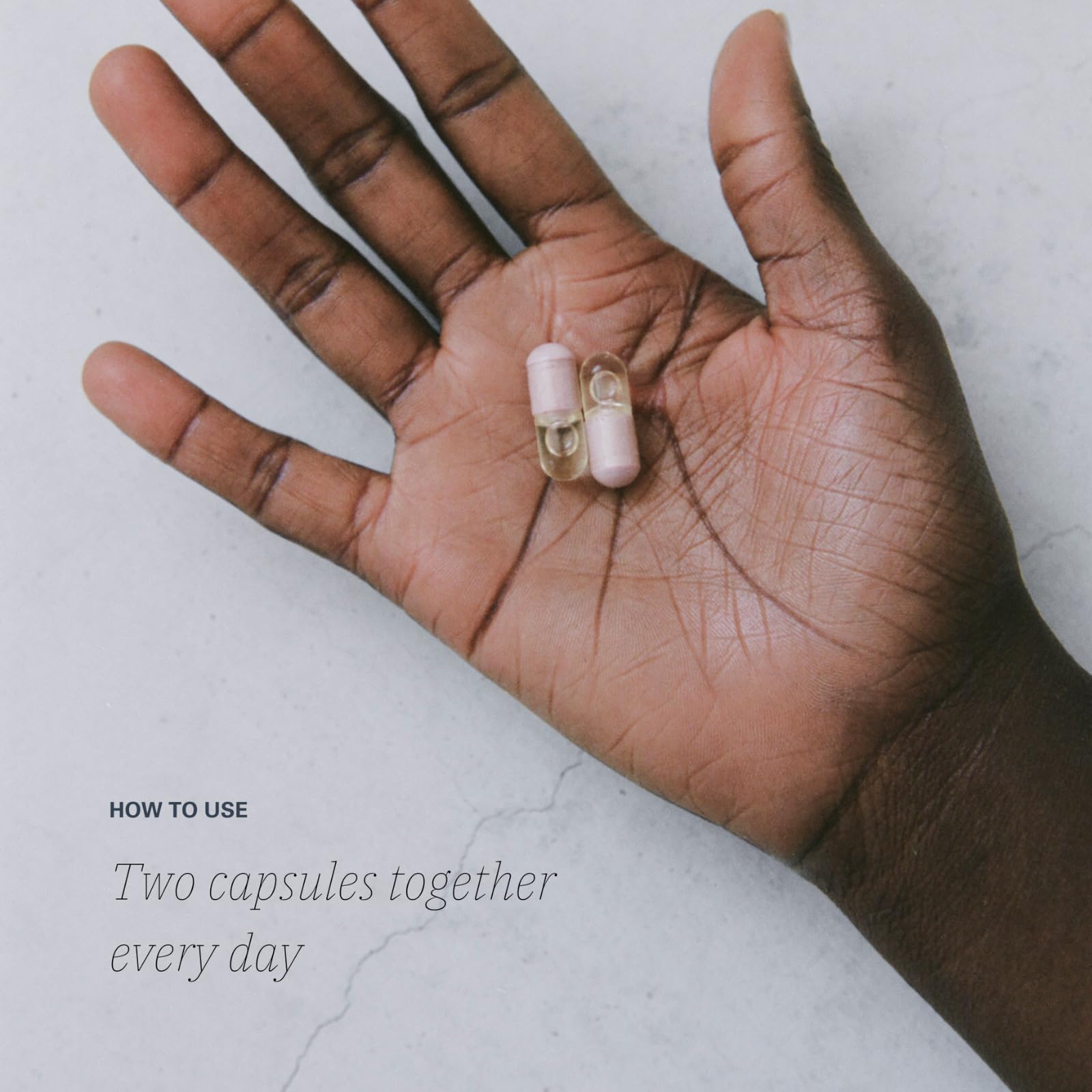 Close-up of L·OONI Balance Capsules for cramps and cravings support.