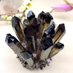 Loverain raw black crystal on a bedside setup suggests tranquil nights.