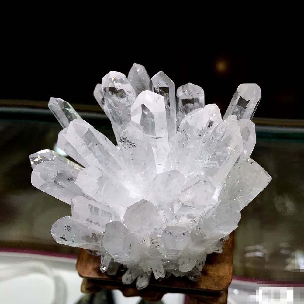 Loverain raw quartz cluster enhances bedroom decor with peaceful ambiance.