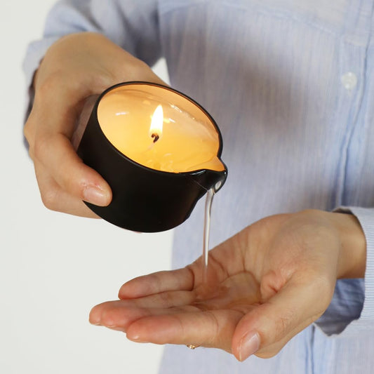 Luxmasa coconut-scent massage candle with natural oils for silky skin.