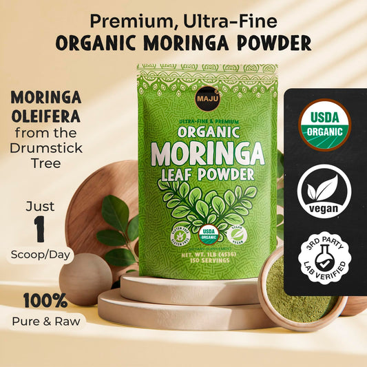 MAJU moringa powder beside a teacup for tea use.