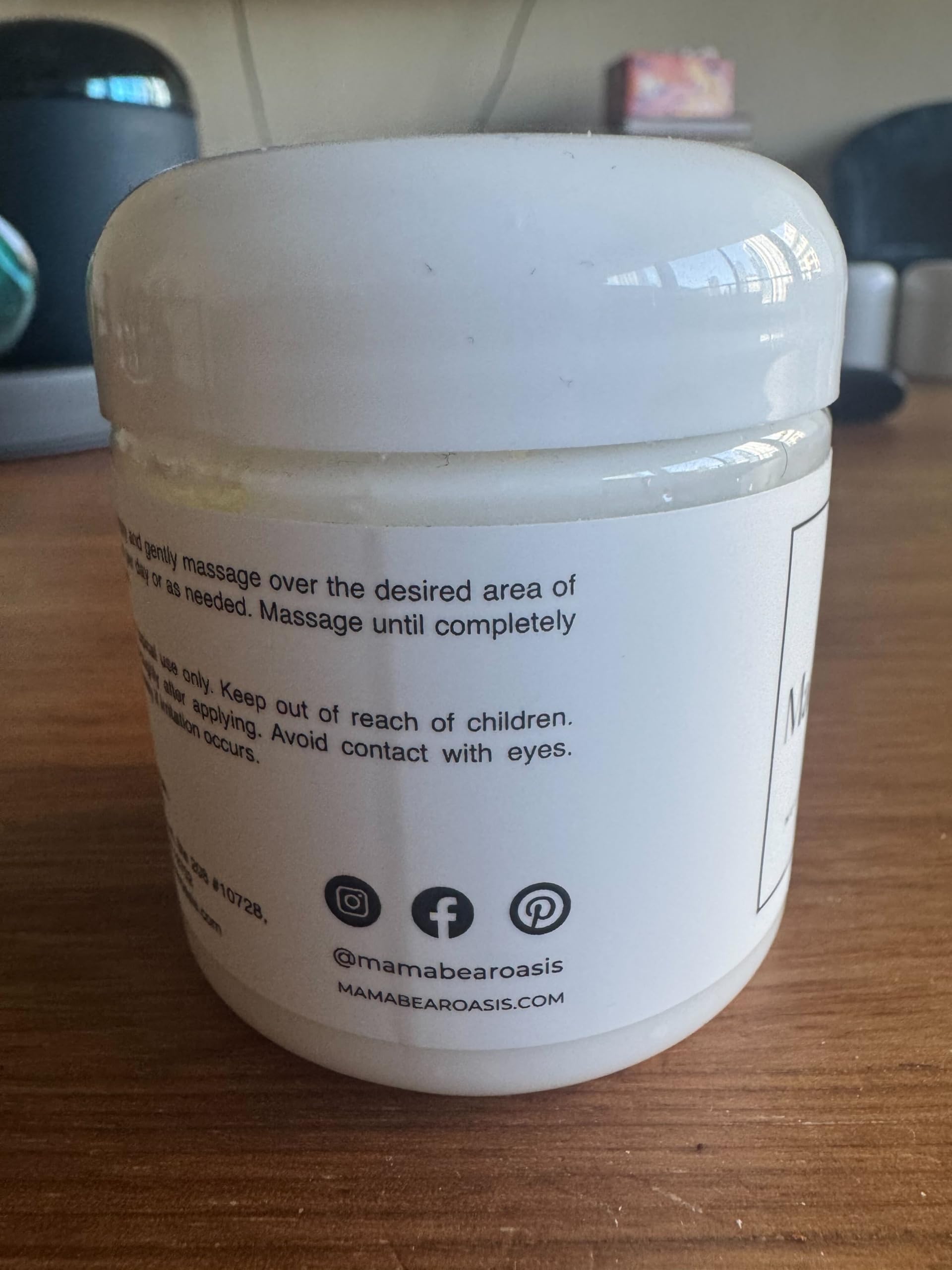 Mama Bear Oasis Lotion on arm shows easy massage for daily care.