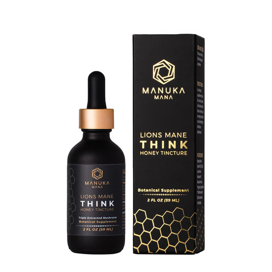 Manuka Mana Lions Mane Think Honey tincture bottle on wooden desk for daily focus.