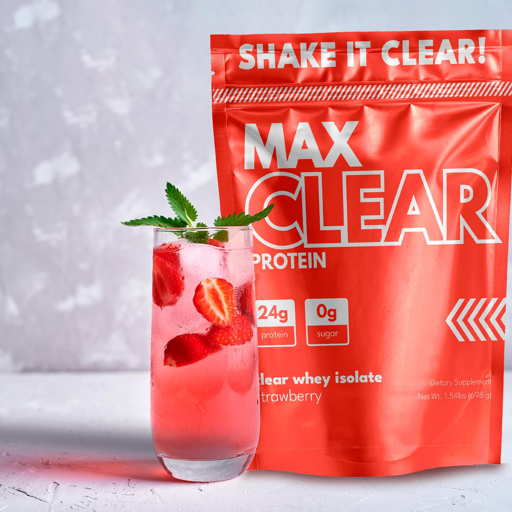 Scoop of Max Clear Protein powder beside glass designed for quick absorption