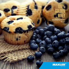Maxler 100% Golden Whey shake in glass with smooth blueberry flavor.