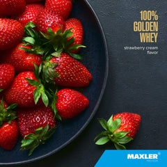 Maxler 100% Golden Whey shake glass showcases creamy Strawberry Cream flavor.