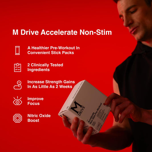 Mdrive Accelerate powder dissolving in water for a berry-flavored pre-workout drink.