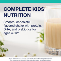 Metagenics MetaKids powder is being mixed into a glass of water.
