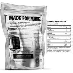 MetCon Whey Protein Isolate scoop close-up reveals powder texture for smooth shakes.