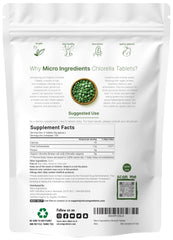 Broken cell wall chlorella tablets close-up highlighting dense nutrients