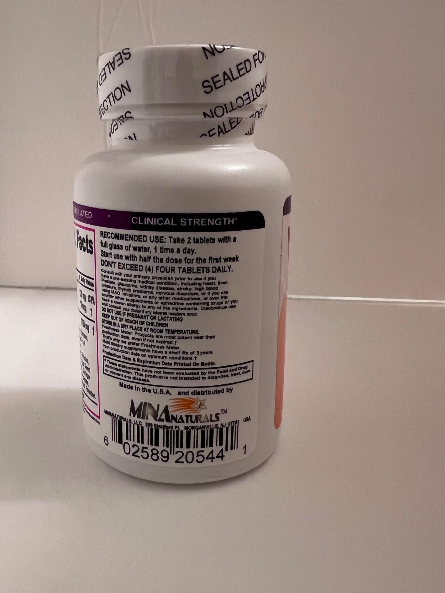 MINANATURALS Varicosolve bottle in hands, accessible and portable.