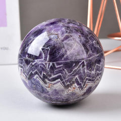 MOGEMT Amethyst crystal ball placed on desk to enhance calm study atmosphere.