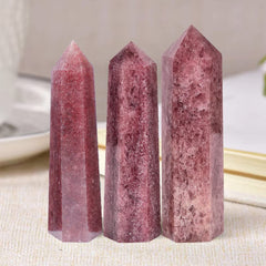 MOGEMT Strawberry Quartz Tower in hand demonstrates portable energy focus