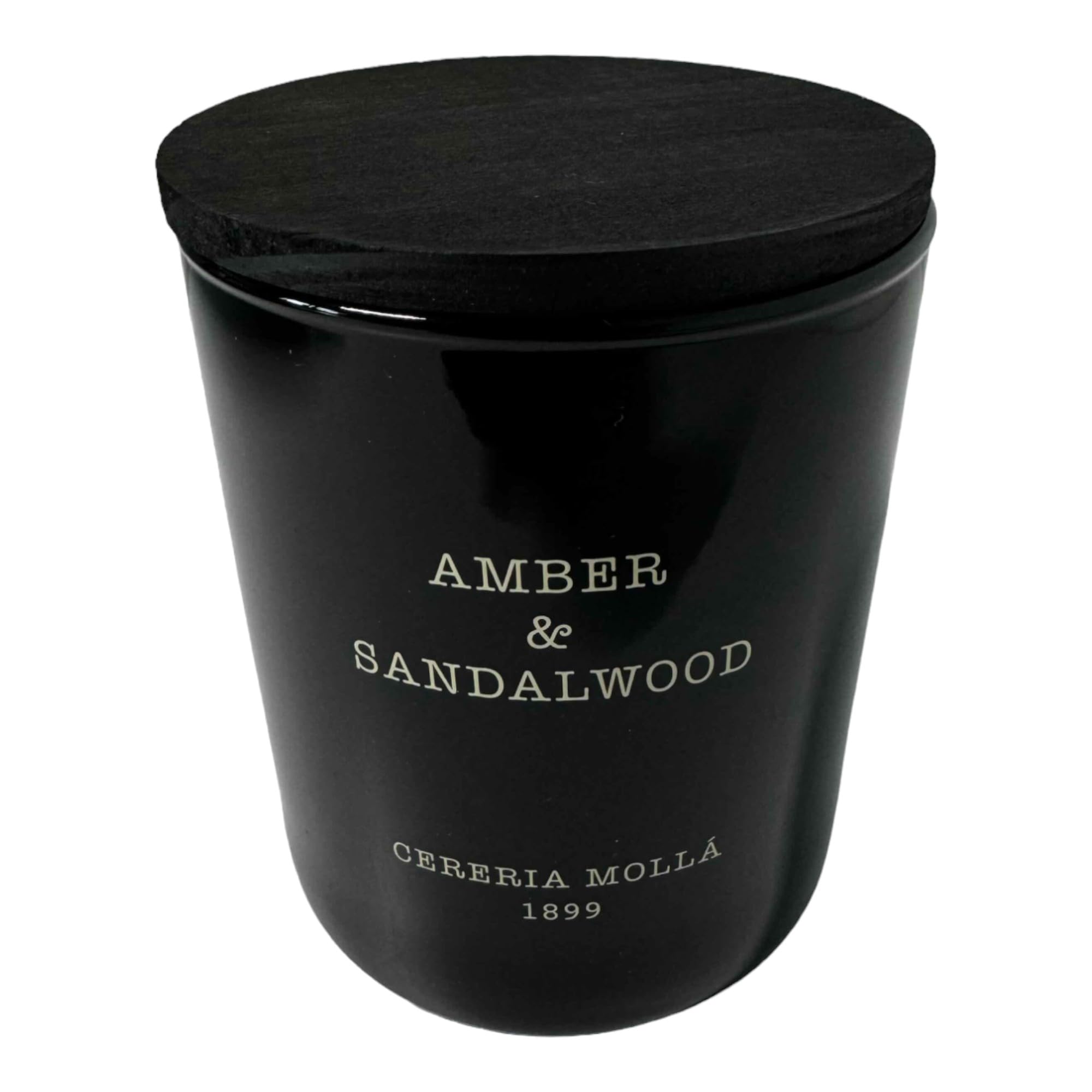 Molla 1899 handmade candle close-up showing amber and sandalwood notes for a warm ambiance.