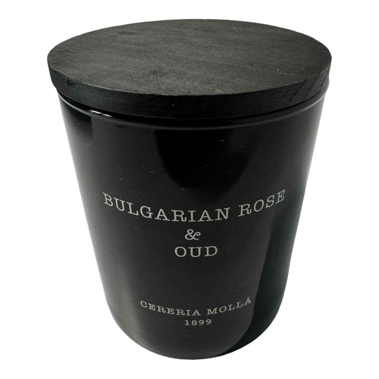 Molla 1899 Bulgarian Rose & Oud candle closeup with warm glow for relaxing evenings.