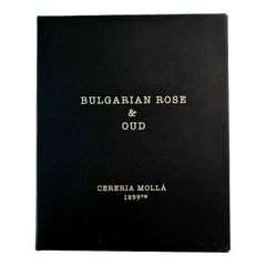 Molla 1899 Bulgarian Rose & Oud candle lit, releasing floral notes to uplift spaces.