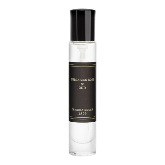 Molla 1899 handmade candle sits on shelf, elevating elegant room ambiance.