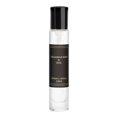 Molla 1899 handmade candle sits on shelf, elevating elegant room ambiance.