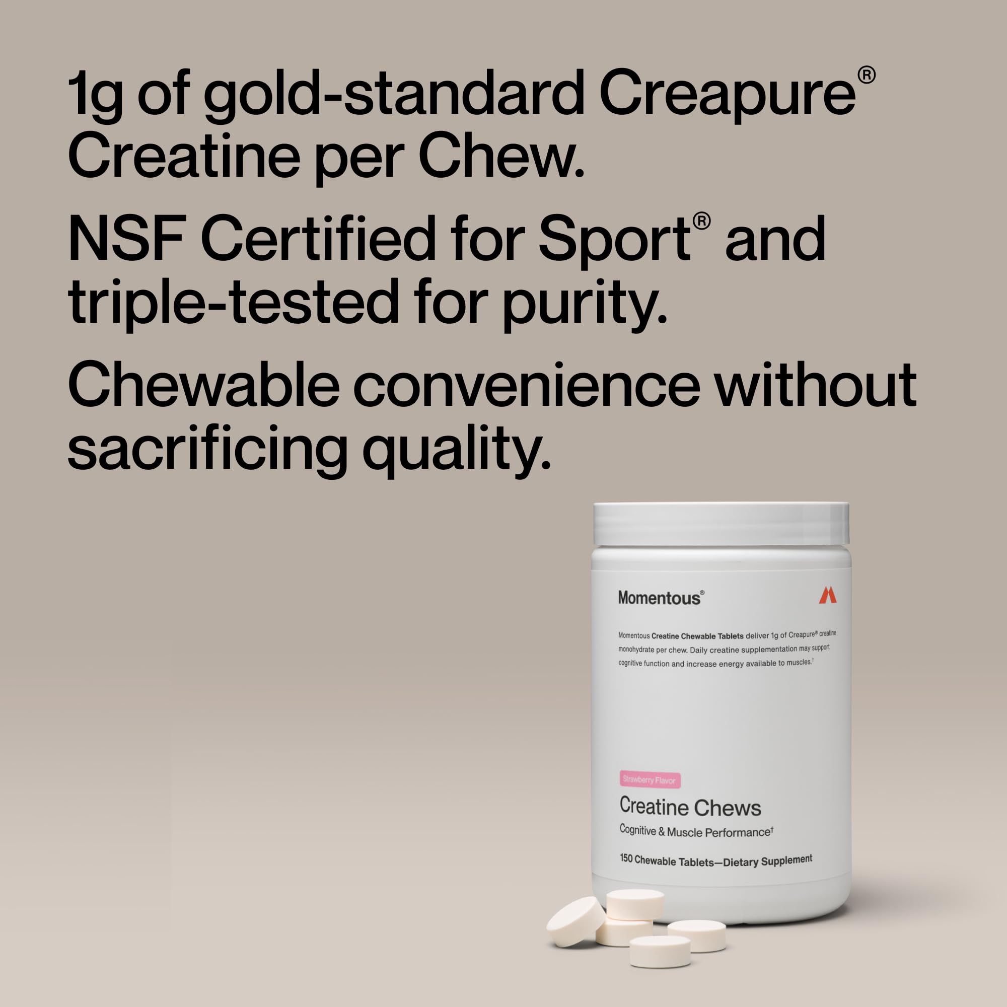 Close-up of Momentous Creatine Chews strawberry tablets ready to chew.