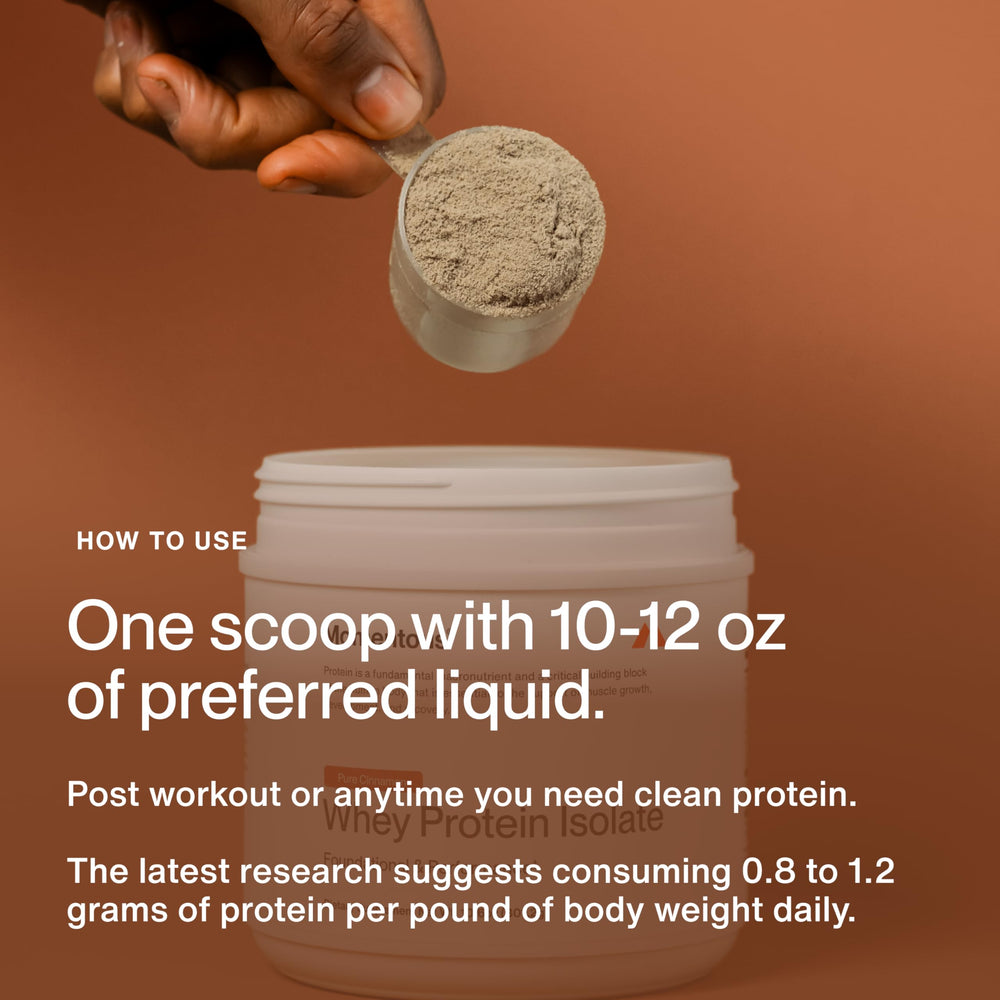 Momentous Essential Grass-Fed Whey Powder mixing glass shows creamy texture