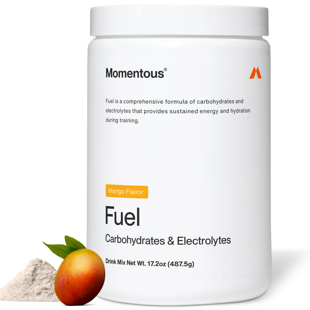 Momentous Fuel bottle pouring mango flavor for sustained energy during workouts