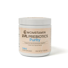 MOMSTAMIN 2'-FL HMO powder being poured into a drink for easy mixing.