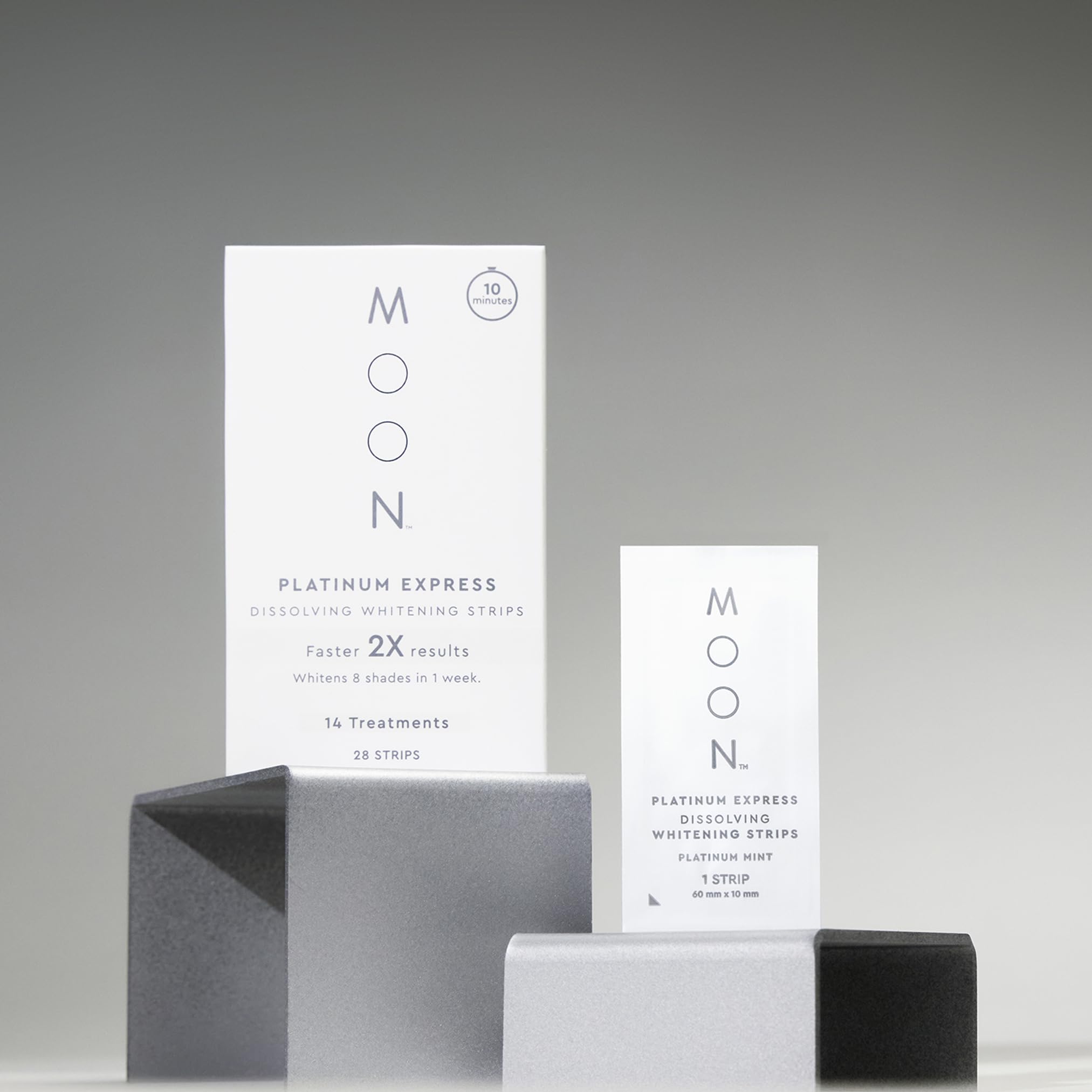 MOON travel essentials kit beside passport enables whitening on the go