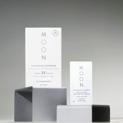 MOON travel essentials kit beside passport enables whitening on the go