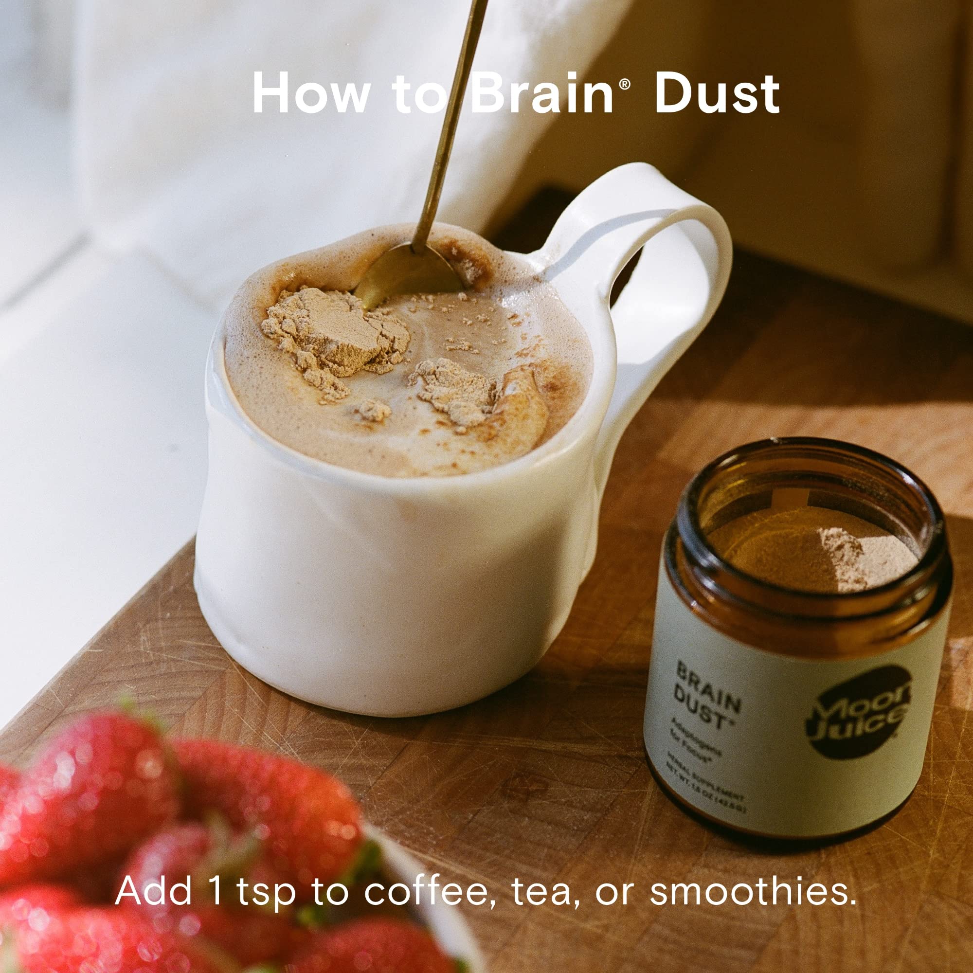 Moon Juice Brain Dust packaging beside a meditation setup for mental stamina.