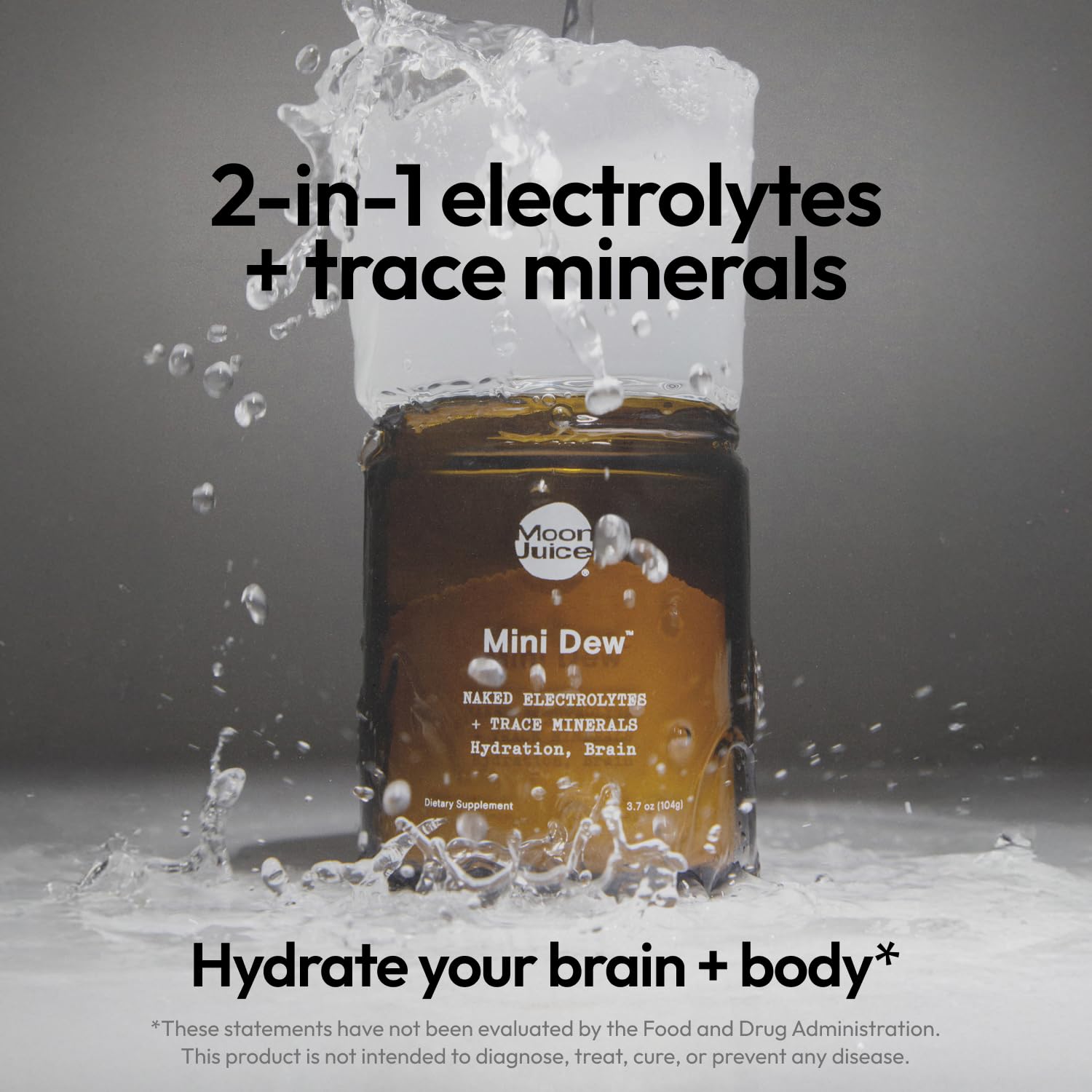 Moon Juice Mini Dew measuring spoon scooping powder for daily hydration.