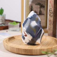 Moonsix orca agate flame tower on desk adds serene decor to workspace.