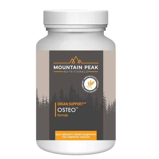 Mountain Peak Osteo bottle close-up with capsules for bone support.