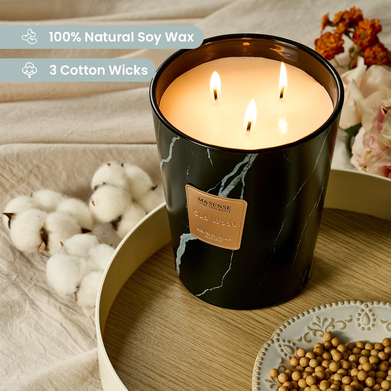 M&SENSE OudWood XL candle with three wicks provides a long-lasting ambient glow.