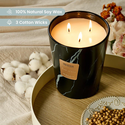 M&SENSE OudWood XL candle with three wicks provides a long-lasting ambient glow.