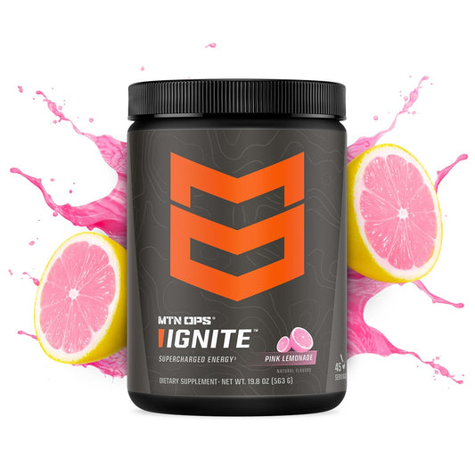 MTN OPS Ignite pink lemonade powder being poured for a clean energy boost.