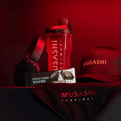 Athlete in training enjoying a Musashi bar during a session.
